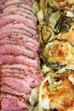 some meat and vegetables are laying on a table together with other food items in the background