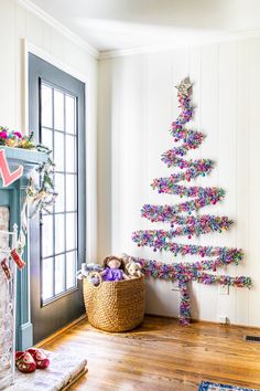 a decorated christmas tree in the corner of a room