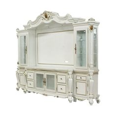 an antique white china cabinet with glass doors