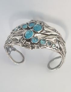 "From Porans collection ----> Unique Silver Cuff bracelet with10 MOP(shells) inlaid. Flexible and can fit any wrist. Dimensions: Max Width: 39 mm\\ 1.56 inches Available with Many other stones! This bracelet will look beautiful with these necklaces: https://www.etsy.com/il-en/listing/206844129/sterling-silver-necklacesstatement?ref=listings_manager_grid https://www.etsy.com/il-en/listing/117386677/sterling-silver-big-gemstone?ref=listings_manager_grid An amazing gift for yourself or loved one Boho Bangle, Wide Cuff Bracelets, Sterling Silver Bangle, Turquoise Bracelet Cuff, Sterling Silver Cuff Bracelet, Bracelet Vintage, Bracelet Sterling Silver, Wide Cuff, Sterling Silver Bangles