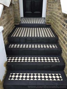 black and white tiled steps leading up to a door