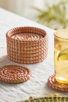 These colorful coasters are hand-woven especially for terrain using natural seagrass. | Woven Seagrass Coasters, Set of 6 in Orange at Terrain Outdoor Coasters, Seagrass Decor, Woven Coaster, Colorful Coasters, Orange Fits, Hand Poured Candle, Serving Trays, 1st Boy Birthday, Accessory Organization