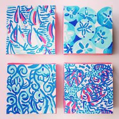 three square paintings with blue and red designs on them