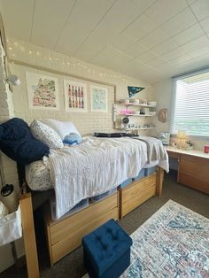 a bed room with a neatly made bed next to a window