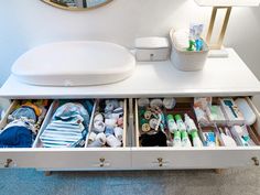 the drawers are organized with items such as toothbrushes and other hygiene products