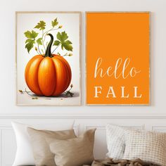 two pumpkins with the words hello fall on them are hanging in a white room