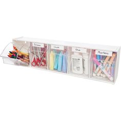 an organized drawer with markers, pencils, scissors and other crafting supplies in it