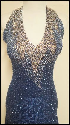 Fitted V-neck Gown With Rhinestones, Fitted Lace Blue Gown, Fitted Blue Lace Gown, Blue Lace Embellished Gown, Blue Fitted Lace Gown, Fitted V-neck Dress With Rhinestones, Fitted V-neck Evening Dress With Rhinestones, Fitted Bedazzled Gown For Party, Fitted Blue Ballroom Dress