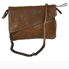 Super Cute A-Symmetric Leather Crossbody Handbag. Magnetic Closure Front, Zippers Inside And On The Back Pocket. Chain And Leather Strap. Height 8 Length 11 Looks Brand New Pocket Chain, Leather Handbags Crossbody, Magnetic Closure, Tan Brown, Chain Strap, Pebbled Leather, Cross Body Handbags, Leather Crossbody, Leather Straps