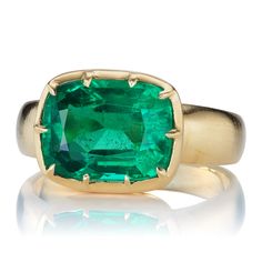 3.93ct Emerald Ring in East-West Setting The Allie 3.93 ring is an AB original design made right here in NYC. The ring centers a C Dunaigre-certified 3.93-carat cushion cut Zambian Emerald of Minor clarity enhancement. The stone is collet set in our signature 18kt yellow gold setting. The ring is currently size 6.25 and can be resized! Why We Love It A bright and vibrant Emerald centers this chunky, golden number. A Victorian-inspired beauty that makes a statement or stacked with bands for a loo Luxury Emerald Ring With Cushion Cut Center Stone, Luxury Cushion Cut Emerald Ring With Center Stone, Luxury Cushion Cut Emerald Ring, Luxury Prong-set Cushion Cut Emerald Ring, Luxury Yellow Gold Cushion Cut Emerald Ring, Luxury Cushion Cut Emerald Ring In Yellow Gold, Luxury Cushion Cut Emerald Ring With Prong Setting, Formal Cushion Cut Emerald Ring In Fine Jewelry Style, Formal Cushion Cut Emerald Ring Fine Jewelry