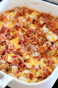 a white casserole dish filled with bacon and cheese