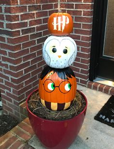 a pumpkin with an owl sitting on top of it