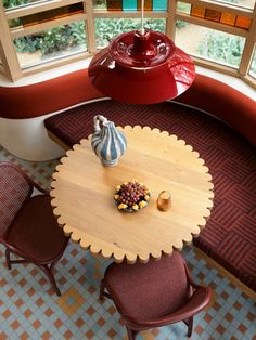 an overhead view of a table and chairs in a room