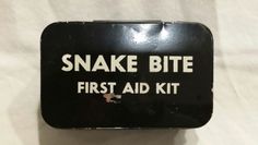 a black and white sign that says snake bite first aid kit on it's side