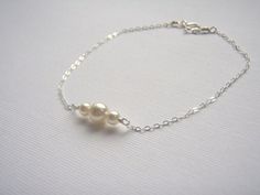 Sterling Silver Bracelet- Pearl Bracelet- White Pearl- Dainty Silver Bracelet- Tiny Pearl Jewelry- 925 Sterling Bracelet. $13.00, via Etsy. White Gold Charm Bracelet For Wedding, Simple Silver Jewelry For Bridesmaid Gift, Minimalist Sterling Silver Pearl Bracelet For Wedding, Delicate Sterling Silver Pearl Bracelet As Gift, Sterling Silver Round Charm Bracelet For Wedding, Dainty White Sterling Silver Bracelet As Gift, Minimalist Sterling Silver Wedding Bracelet, Delicate Sterling Silver Bracelet For Wedding, Wedding Sterling Silver Minimalist Bracelet