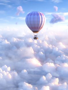 a hot air balloon flying through the clouds