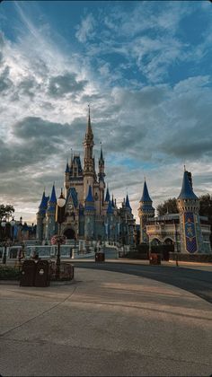 an amusement park with a castle in the background