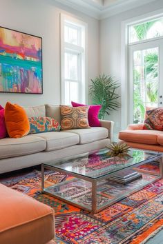 a living room filled with lots of furniture and colorful pillows on top of it's couches