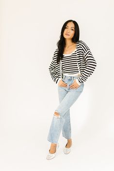 it’s a tank, it’s a cardigan – it’s a tank + cardigan combo. detailed with a retro-inspired black + white stripe pattern, this cropped sweater tank + cardigan set is a spring outfit staple. wear them together or separately to elevate any outfit. black + white // two piece set, scoop neckline, buttons, drop shoulder paired with our sicily distressed denim model is 5'8" + wearing a small measurements are approximate + taken while laying flat small : bust 44” length 18.5” tank: small : bust 28” len Chic Knit Cropped Sweater For Spring, Chic Striped Cardigan For Spring, Casual Cropped Sweater For Spring Layering, Trendy Cropped Summer Cardigan, Chic Cropped Sweater For Spring Day Out, Spring Knit Crop Top For Layering, Casual Cropped Sweater For Day Out, Knit Crop Top Sweater For Spring, Trendy Striped Cropped Sweater For Spring