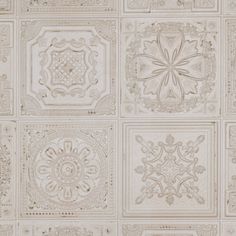 a wall with many different designs and shapes on the walls, including an intricately designed design