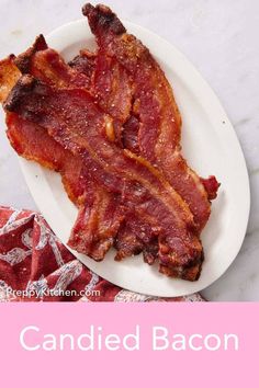 bacon on a white plate with the words candied bacon