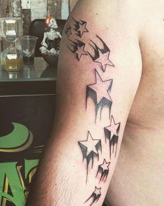 a man's arm with stars on it