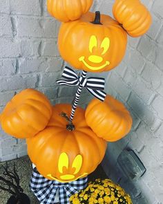 mickey mouse pumpkins are stacked on top of each other