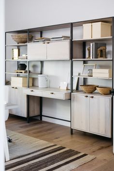 a room that has some shelves on the wall and other items on the floor in front of it