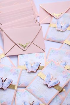 pink and gold envelopes with butterflies on them