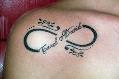 a woman with a tattoo on her shoulder that says, carol of paris and an oval