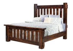 a bed with wooden headboard and foot board