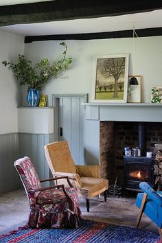 a living room filled with furniture and a fire place