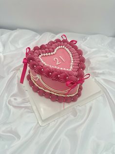 a heart shaped cake on a white tablecloth