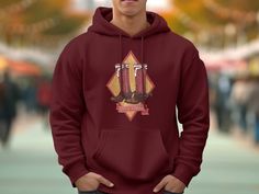 Yeehaw! Get cosy in this punchy stovetop cowboy boots and vintage spur UNISEX western graphic hoodie sweatshirt! It's perfect for your next rodeo or country concert! Classic buckaroo cowboy/cowgirl gear for a fun western hoodie design. Keep it ranchy! 🌵 Quality, premium hoodie made from 80% ringspun cotton, 10% polyester, 10% recycled polyester. Grey Heather Fabrication:70% ringspun cotton, 20% polyester, 10% recycled polyester Charcoal Heather Fabrication: 60% ringspun cotton, 30% polyester, 1 Helmet Designs, Football Sweatshirt, Western Saddle, Helmet Design, Red Boots, Vintage Horse, Cowboy Cowgirl, Cow Girl, Gifts For Art Lovers