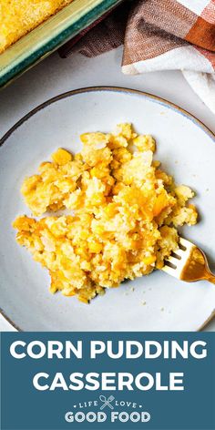 corn pudding casserole on a white plate with a fork next to the casserole