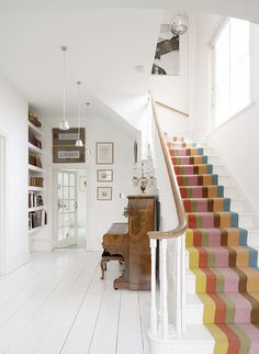 the stairs in this house are painted bright colors