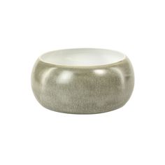 a gray and white bowl sitting on top of a table