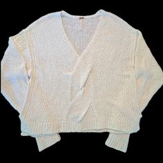 Elevate Your Beach, Bohemian, And Outdoor Look With This Free People Sweater. The Twist Front V-Neck And Long Sleeves Make It A Perfect Fit For Summer, Fall, And Spring. The Lightweight And Breathable Cotton Knit Material Adds Comfort To Style. Hand Wash Only To Keep It Looking Brand New. The Solid Pattern And White Color Offer An Oversized Fit For A Small Size. This Pullover Sweater Is Perfect For Any Occasion And Is Not To Be Missed. Excellent Like New Condition White Bohemian V-neck Sweater, White V-neck Cropped Sweater For Fall, White Bohemian V-neck Knit Top, Bohemian White V-neck Knit Top, White V-neck Bohemian Knit Top, Oversized Red Sweater, Outdoor Look, Beach Bohemian, Oversized Sweater Women