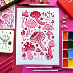 a painting with pink ink and watercolors next to it is an assortment of art supplies