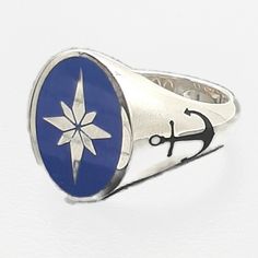 💍 Amazing gold North Star signet ring.       Unisex oval chevalier ring. 📜 A North Star sign engraving on top anchor engraving on bands, with hand polishing and blue &         black enamel work!        Comes in gold K9, K14, or K18 with a fantastic optical look. Available in yellow gold, white gold, and rose gold.  ⚖ Ring weight approximately 16 gr. 📐 Total dimensions 14x18 on top .  ✍ Designed and created by Babuco Jewellery Athens.  ♻   Recycled item! 💍 A special gift for your loving perso Classic Blue Oval Cabochon Signet Ring, Blue Oval Cabochon Signet Ring With Polished Finish, Classic Blue Oval Signet Ring, Blue Oval Hallmarked Signet Ring, Symbolic Oval White Gold Signet Ring, Oval Blue Engraved Ring, Recycled Items, North Star, Black Enamel