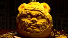 a carved pumpkin with an evil face on it