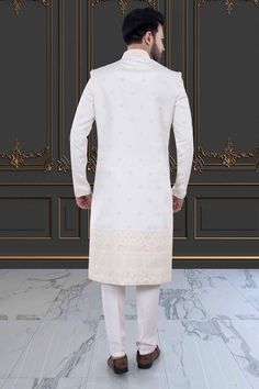 Embody classic elegance with our Mens Sherwani- U2-S379. Featuring delicate thread embroidery adorned with shimmering sequins, this Groom's sherwani exudes sophistication and luxury. Perfect for weddings and special occasions. Elevate your style and make a lasting impression. Elegant Embroidered Sherwani Straight Kurta, Elegant Sherwani With Chikankari Embroidery For Diwali, Fitted Long Sherwani With Chikankari Embroidery, Elegant Long Sleeve Churidar For Reception, Elegant Long Sleeve Sherwani With Chikankari Embroidery, Fitted Long Bandhgala With Chikankari Embroidery, Long Fitted Kurta With Naqshi, Elegant Embroidered Ceremonial Churidar, Elegant Long Sherwani For Diwali