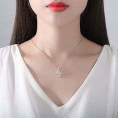 Silver-plated pendant necklace with sparkling cubic zirconia and crystals. Chain : 15.75" L with 1.96" extender Pendant : 0.43" W x 0.86" L Lobster claw clasp Silver-plated copper / cubic zirconia / crystal Brilliant Cut Cubic Zirconia Pendant Necklace, Sparkling Cubic Zirconia Pendant Necklace, Silver Diamond-shaped Cubic Zirconia Necklace, Nickel-free Cubic Zirconia Pendant Jewelry, Nickel-free Cubic Zirconia Pendant Necklace, Pear Shape Pendant, Pear Shaped Pendant, Pear Cut, Pear Shape