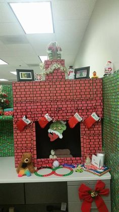 an office cubicle decorated for christmas with decorations