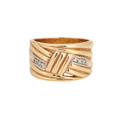 Stylish vintage diamond wide band crafted in 14 karat yellow gold (circa 1980s).  Six diamonds total an estimated 0.06 carats (estimated at H-I color and SI1-I1 clarity).  With an opposing ridged design the wide band (12.5mm - 0.49 inches) sits flat and comfortably on the finger. Ideal worn alone as a statement piece or stacked. The ring has a low rise (2.5mm - 0.09 inches).   The ring is in good condition and was lightly cleaned and polished.  Particulars: Weight: 12.1 grams Stones:  Six diamon Masonic Jewelry, Russian Jewelry, Antique Jewelry Rings, Art Nouveau Jewelry, Deco Jewelry, Victorian Jewelry, Art Deco Jewelry, Dream Jewelry, Wide Bands