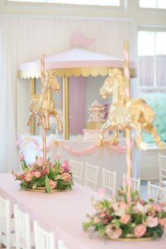 there is a pink and gold table set up for a princess party with unicorns on it