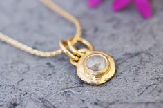 "Gold and a raw diamond pendant necklace in 14k, 18k, 22k yellow and 14k white, and rose gold.  This Gold Boho Necklace is stunning and unique. It has a raw and round diamond set in a solid gold pendant. The pendant has a rough and distinct handmade look. This impressive pendant has a \"handle\" connected to the necklace with two gold loops.  This beautiful necklace is eye-catching but very dainty and will complement any outfit. The necklace's antique-style and rustic design combined with the ra Gold Boho Necklace, Raw Diamond Jewelry, Raw Diamond Necklace, Beautiful Pendant Necklace, Solitaire Diamond Pendant, Beautiful Gold Necklaces, Round Diamond Setting, Jewelry Real, 18k Gold Necklace