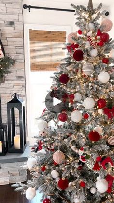 a decorated christmas tree with red, white and silver ornaments