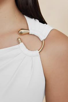 The Summerston Top in Ivory is a classic silhouette. Designed to be a wardrobe staple, featuring luxurious gold hardware at the shoulder and soft gathering through the bodice. This piece is crafted from our best selling jersey fabrication. - Stretch jersey fabrication - Lined - Invisible back zip - Gold hardware Model is 180cm / 5'10″ wearing an AU 8 / US 4 Composition: 70% Viscose Rayon, 30% Polyester Clothes Details Aesthetic, Shoulder Design, Bodice Designs, Clothes Details, Unique Tops, Unique Sewing Patterns, Minimalist Top, Sew Your Own Clothes, Fashion Design Template