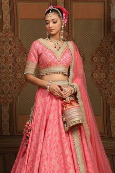 Rouge pink cotton shimmer chanderi lehenga with attached cancan, abstract petal patterns, intricate gota, dori and badla work and pink-orange broad border. Comes with padded, gota work blouse and lace border net dupatta. - Aza Fashions Pink Sets With Motifs For Reception, Pink Motif Sharara For Reception, Designer Pink Lehenga With Motifs, Badla Work, Chanderi Lehenga, Gota Work, Pink Lehenga, Net Dupatta, Flower Petal